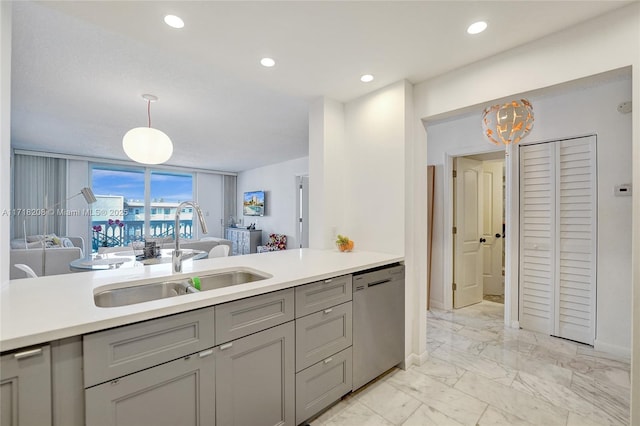 kitchen with dishwasher, decorative light fixtures, gray cabinets, and sink