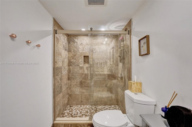 bathroom with walk in shower and toilet