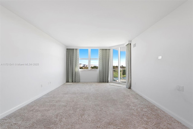 empty room with carpet flooring