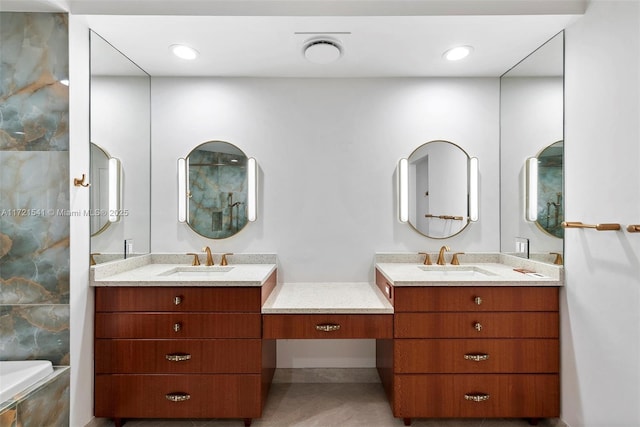 bathroom with tile patterned floors and vanity