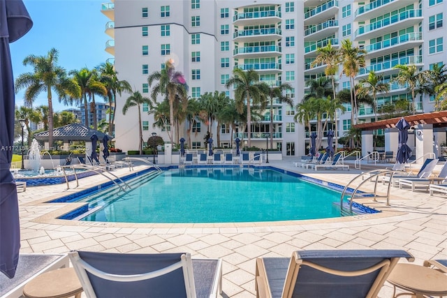 view of swimming pool with a gazebo and a patio area