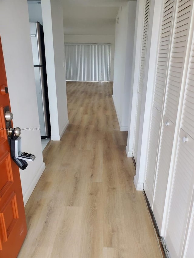 hallway featuring light hardwood / wood-style flooring