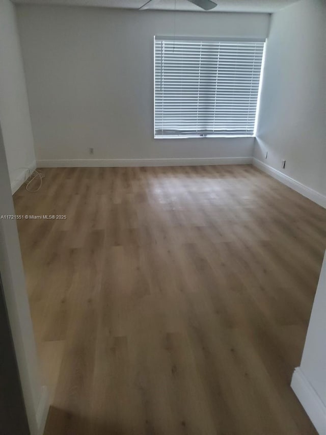 empty room featuring wood-type flooring