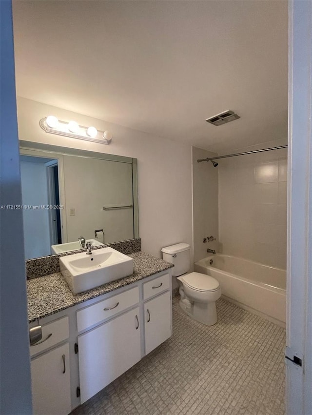 full bathroom featuring bathtub / shower combination, vanity, and toilet