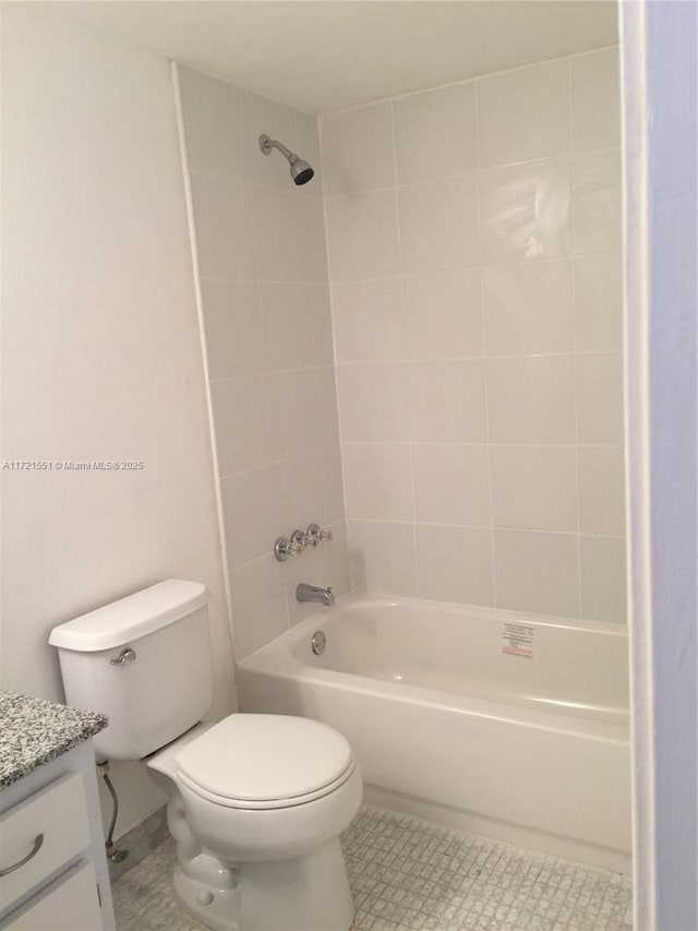 full bathroom with vanity, toilet, and tiled shower / bath