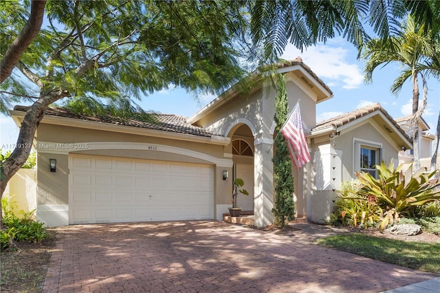 mediterranean / spanish house featuring a garage