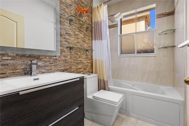 full bathroom featuring tile patterned flooring, shower / tub combo, vanity, and toilet