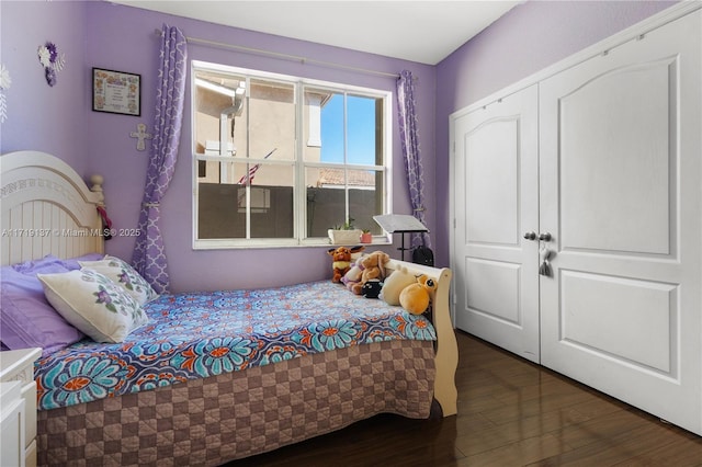 bedroom featuring dark hardwood / wood-style flooring