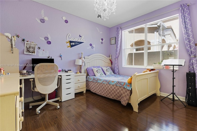 bedroom with an inviting chandelier and dark wood-type flooring