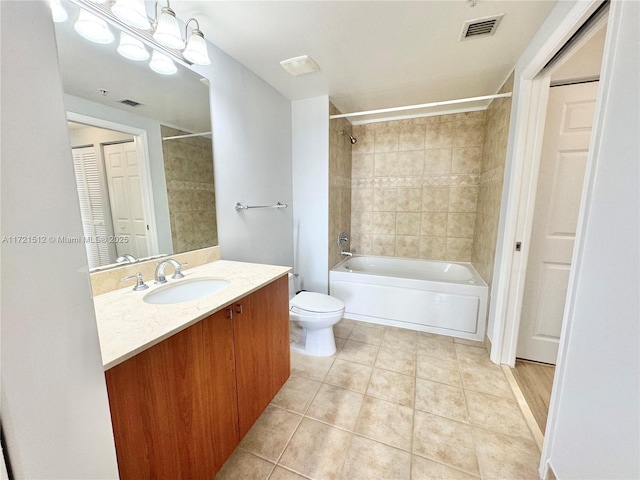 full bath featuring tile patterned floors, visible vents, toilet, shower / bathing tub combination, and vanity