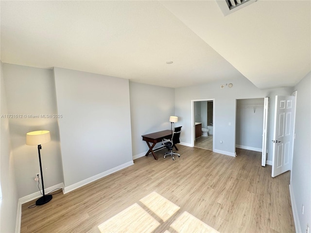 home office featuring visible vents, baseboards, and light wood-type flooring