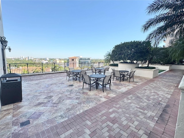 view of patio featuring outdoor dining area