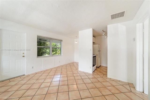 view of tiled spare room