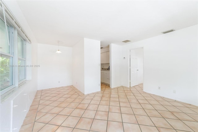 tiled empty room with sink