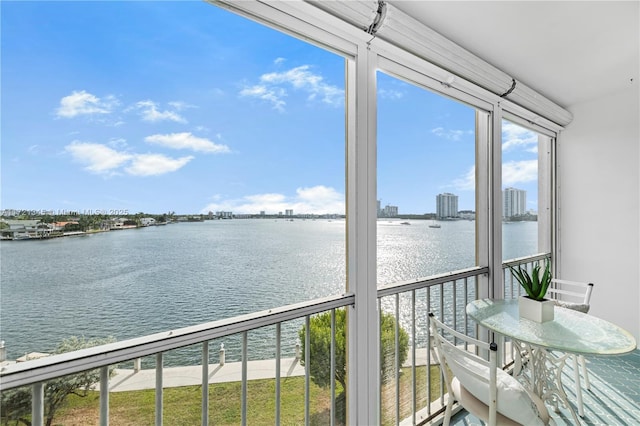 unfurnished sunroom with a healthy amount of sunlight and a water view