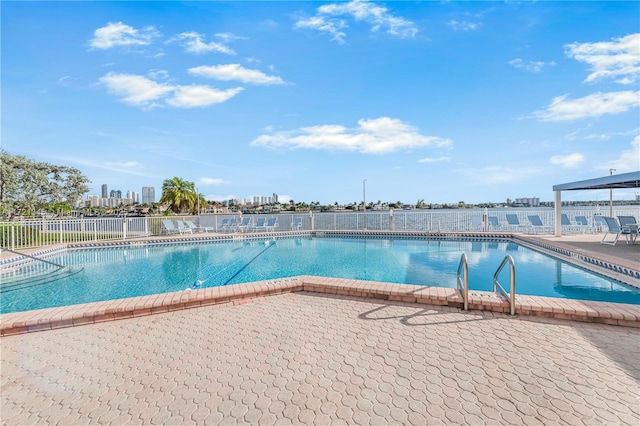 view of swimming pool featuring a patio area