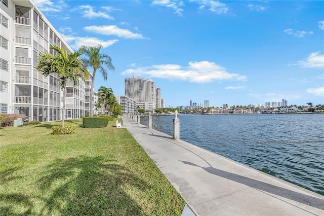 exterior space with a yard and a water view