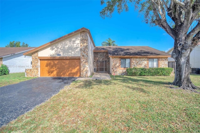 view of front facade with a front yard and a garage