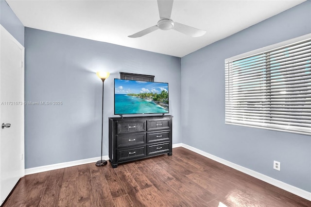 bedroom with ceiling fan and dark hardwood / wood-style floors