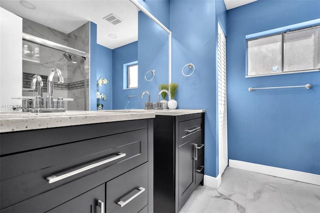 bathroom featuring vanity and an enclosed shower