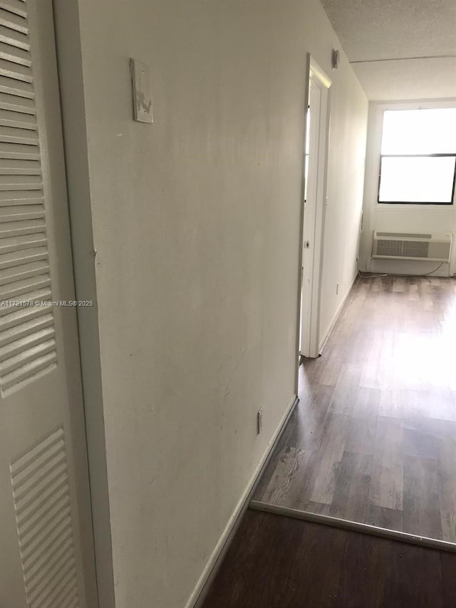 corridor featuring hardwood / wood-style flooring