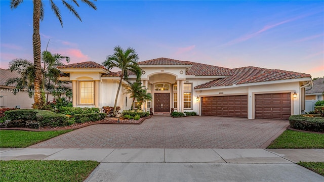 mediterranean / spanish-style house featuring a garage