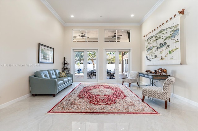 living room featuring ceiling fan, ornamental molding, and french doors