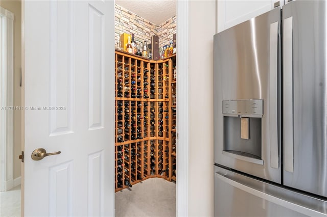 wine room featuring a textured ceiling