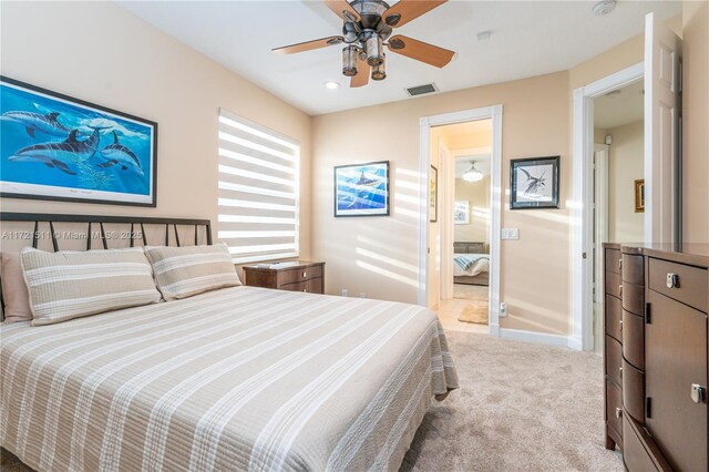 bedroom featuring ceiling fan and light carpet