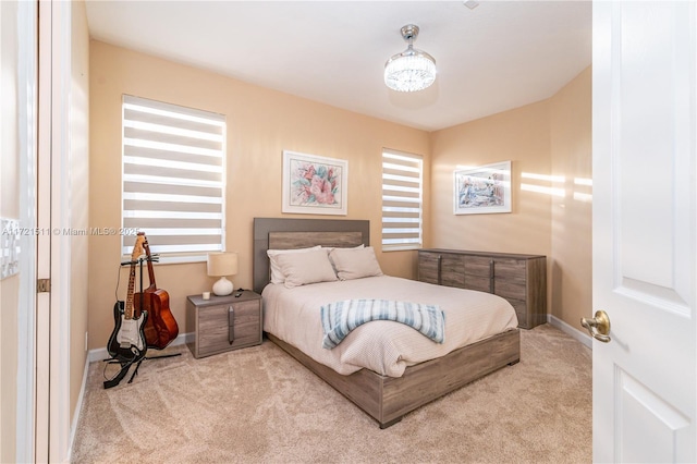 bedroom with light carpet