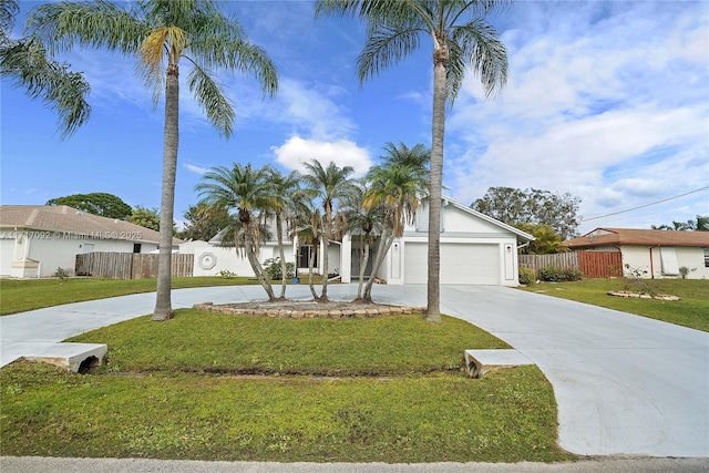 view of front of home with a garage and a front lawn