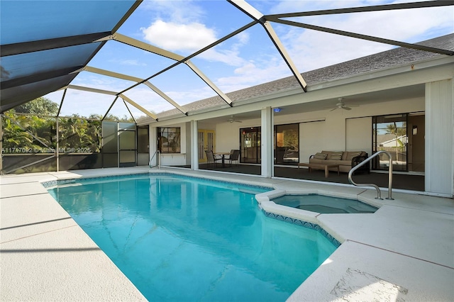 view of pool featuring ceiling fan, a patio area, and glass enclosure