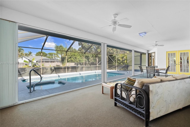 interior space with ceiling fan, french doors, and carpet