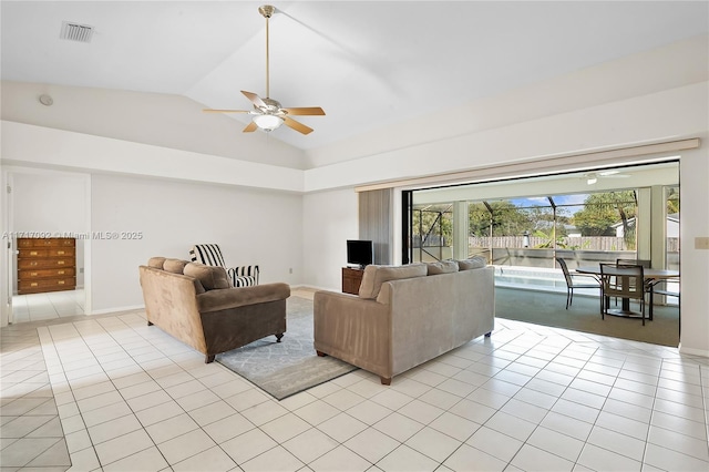 living room with light tile patterned floors, vaulted ceiling, and ceiling fan