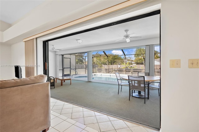 carpeted dining room with ceiling fan and a wealth of natural light