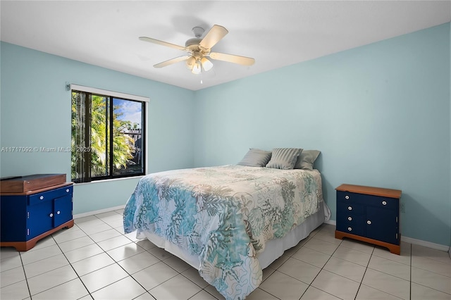 tiled bedroom with ceiling fan