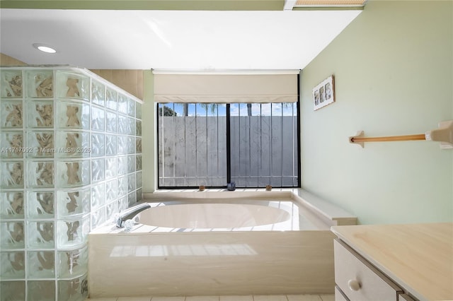 bathroom with a bathtub and vanity