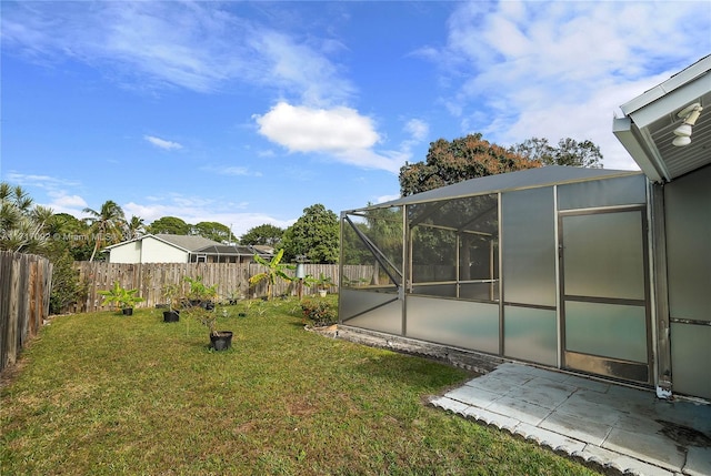 view of yard with a patio area and a lanai