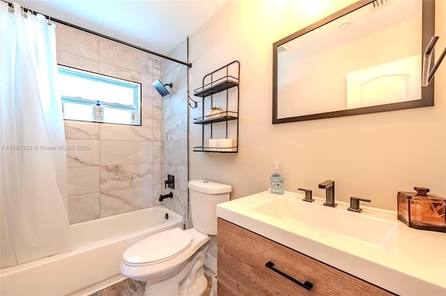 full bathroom featuring toilet, vanity, and shower / tub combo