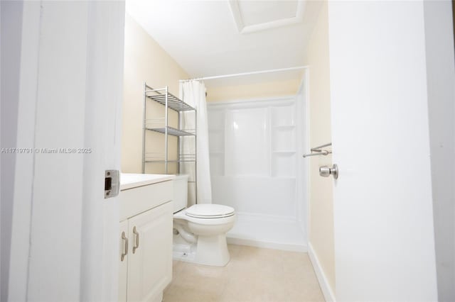 bathroom featuring tile patterned flooring, a shower with curtain, vanity, and toilet