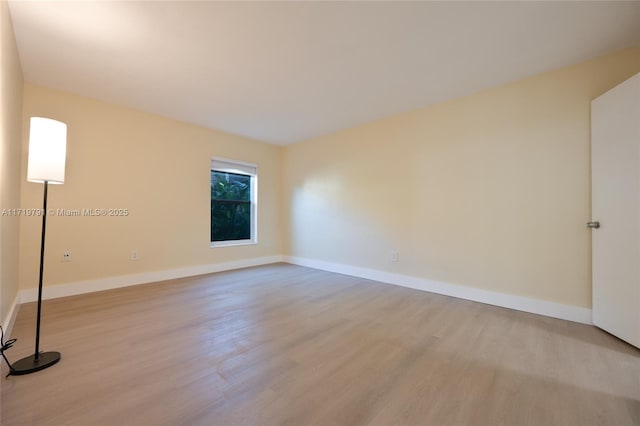 unfurnished room featuring light hardwood / wood-style flooring