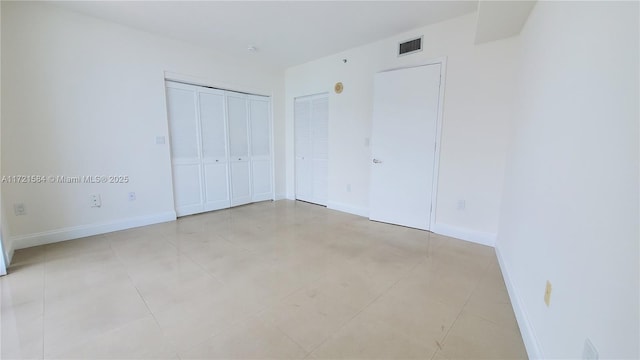 unfurnished bedroom featuring light tile patterned floors