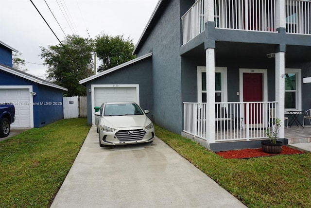 view of front of home featuring a front yard, covered porch, and a balcony