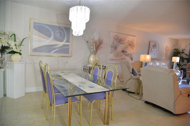 dining area featuring an inviting chandelier