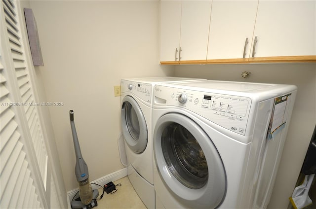 washroom with cabinets and separate washer and dryer