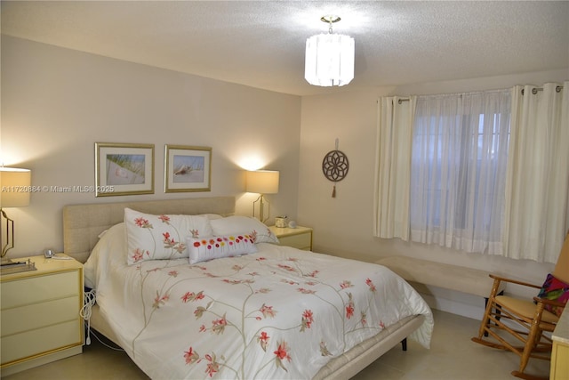 bedroom featuring a textured ceiling