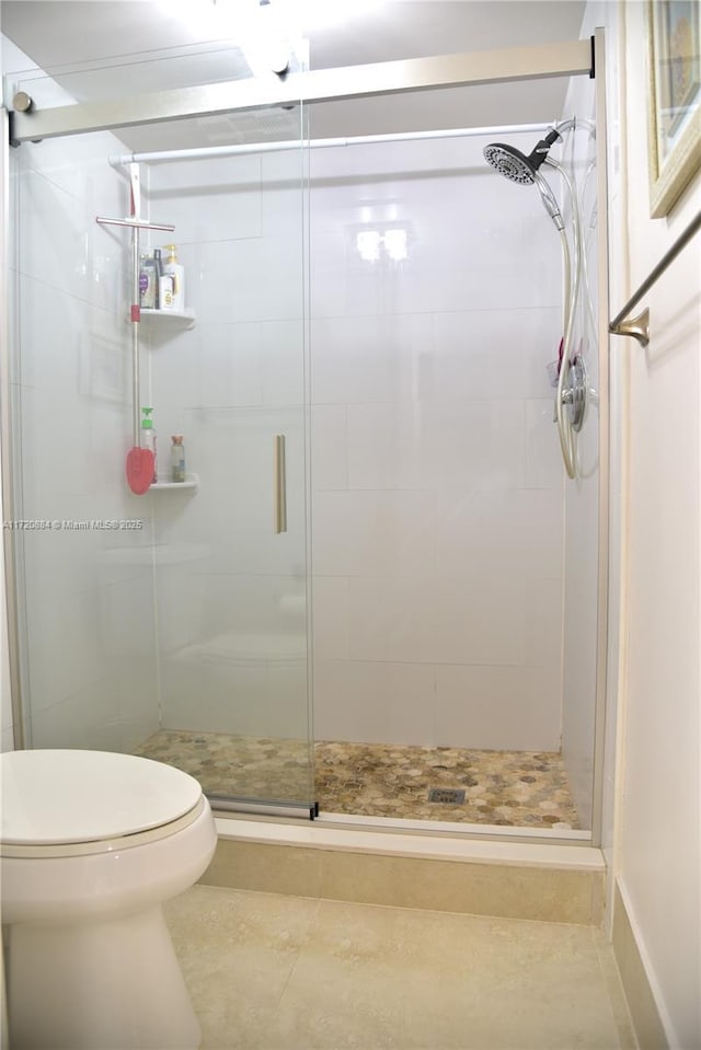 bathroom with walk in shower and toilet