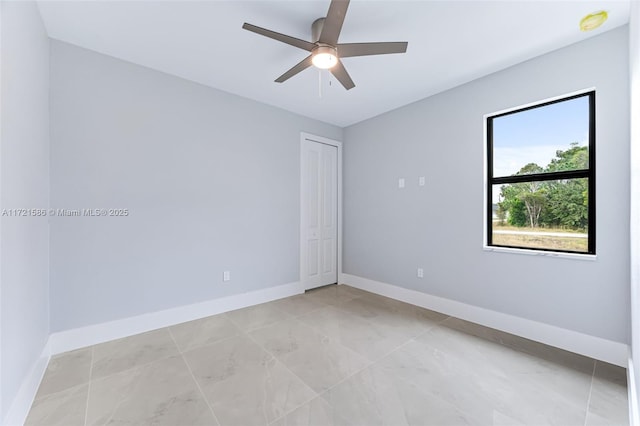 spare room with ceiling fan