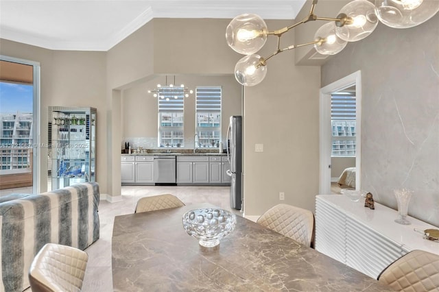 dining room featuring ornamental molding and a notable chandelier