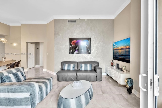 living area with marble finish floor, ornamental molding, visible vents, and baseboards